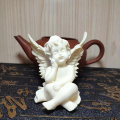 Intricately Carved Ivory Fruit Angel Figurine with Box